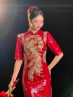 Create a luxurious bridal outfit with a red sequin phoenix cheongsam dress. Look fabulous at your Chinese wedding ceremony in this elegant cheongsam tailored in a classic red color. The traditional phoenix embroidery on the sequin bridal cheongsam symbolizes a harmonious marriage. Red Embellished Dresses For Festivals, Red Sequin Dress For Festive Occasions, Party Dresses For Festivals With Short Sleeves, Red Dresses For Celebration And Festivals, Red Dress For Celebration And Festivals, Red Embellished Festival Dresses, Fitted Red Sequin Dress For Festive Occasions, Red Fitted Sequin Dress For Festive Occasions, Festive Sequin Dresses For Red Carpet