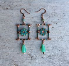 ✦Beautiful and original artisan designed turquoise green and copper bohemian earrings are a must have if you love handmade designer fashion. ✦Spiritual jewelry designed and carefully handcrafted by Rushweaver Jewellery in a ancient earthy tribal style. ✦These boho beauties dandle 75mm from top of solid brass copper plated, nickel free earring hooks. ✦For all free spirited women who want to enjoy there unique style! ✦100% artisan handmade... Handmade Square Bohemian Earrings, Handmade Bohemian Square Earrings, Handmade Square Green Jewelry, Handmade Rectangular Copper Earrings, Green Copper Earrings For Gift, Square Green Handmade Earrings, Handmade Green Square Earrings, Handmade Square Green Earrings, Handmade Green Copper Earrings