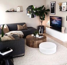 a living room filled with furniture and a flat screen tv