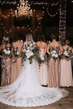 the bride and her bridal party are standing together