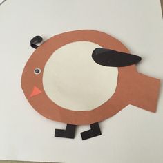 a paper plate with a bird cut out of it