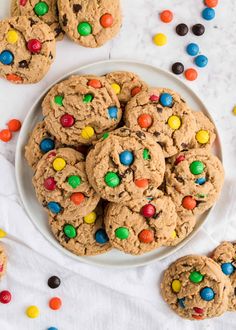 a plate full of cookies with m & m on top