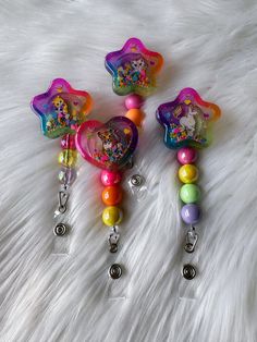 "Glitter shaker badge reel. Badge Reels are handmade so they may vary slightly in exterior color and interior pieces may vary by color/shape/size. Seller not responsible for leaks or breaks. Badge reels are made to order, slight imperfections may occur. These imperfections do not affect the functionality of the badge reel. I do try my best to make each one as perfect as I can. For Beaded reels, I will pick random colored beads that won't always be the same as pictured but will remain colorful. B Rhinestone Badge Reel Diy, Resin Badge Reel Ideas, Badge Reels Diy Ideas, Resin Badges, Bubble Crafts, Nurse Crafts, Badge Reels Diy, Badge Buddies