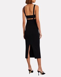 In true Dion Lee fashion this stretchy knit midi dress comes equipped with sultry cut-outs formed by strappy interlinking fabric. Wear yours for a night out with a slip-on mule and evening-ready clutch.   Fabric: 47% viscose, 29% nylon, 12% polyester, 8% cotton, 4% elastane.   Pull-over style.   Dry clean.   Imported.       Length from shoulder to hem: 42" (approximately).   Model is wearing size S.  Model height 5'11", bust 32", waist 24", hips 34". Chic Elastane Bandage Dress For Night Out, Chic Bandage Dress For Night Out, Chic Elastane Bandage Dress For Party, Summer Evening Elastane Bandage Dress, Summer Evening Bandage Dress In Elastane, Summer Evening Bandage Dress Made Of Elastane, Evening Bodycon Bandage Dress With Cutout, Sleek Elastane Midi Dress For Date Night, Chic Elastane Midi Dress For Night Out