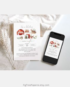 an image of a phone next to a wedding card on a white table with flowers