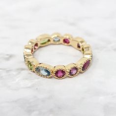 Gold Plated Colorful Stones Eternity Gemstone Ring | Harfi | Wolf & Badger Multicolor Oval Birthstone Promise Ring, Multicolor Oval Ring With Gemstone Accents, Multicolor Multi-stone Birthstone Ring, Oval Shaped, Multicolor Oval Birthstone Ring With Accent Stones, Multi-stone Cubic Zirconia Crystal Ring, Elegant Multicolor Rings With Bezel Setting, Gold Oval Multi-stone Stackable Rings, Multicolor Oval Crystal Gemstone Ring, Multicolor Oval Crystal Ring With Gemstone