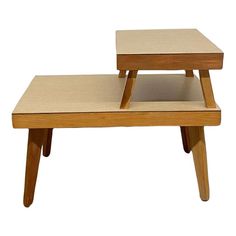 two wooden tables sitting on top of each other in front of a white background,