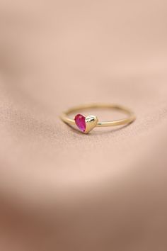 "Handmade Gold Heart With Natural Ruby / 14k 18k Gold Genuine Ruby Ring Available in Gold, Rose Gold and White Gold / July Birthstone ❥ ITEM DETAILS ---> Gold Color of Choice : Yellow Gold, Rose Gold, White Gold ---> Material : 14k ( 585 ) or 18k ( 750 ) Real Gold. It is Not Gold Filled or Gold Plated ---> Made to order ---> Band Thickness : 1.20 mm ---> Band Width : 1.30 mm ---> Ruby Cut: Pear Shape Ruby ---> Number of Stones: 1 Pear Shape Ruby ---> Total Carat : 0.20ct 14k Gold Heart Cut Gemstone Jewelry, 14k Gold Heart-shaped Ruby Promise Ring, Valentine's Day Yellow Gold Ruby Jewelry, Heart-shaped 14k Gold Ruby Promise Ring, Pink 14k Gold Heart Ring Gift, Pink 14k Gold Heart Cut Jewelry, Pink Heart Cut 14k Gold Jewelry, 14k Gold Heart-shaped Ruby Ring For Promise, Valentine's Day Gemstone Rings Fine Jewelry