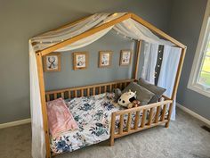 a child's bed with a canopy over it