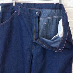 "40x33 Vintage Men's 1970s 1980s Big Mac Denim Painter Carpenter Pants Jeans For your consideration we have a pair of jeans from the '70s/'80s. Made by Big Mac and done in blue denim with contrast orange stitching, these pants feature two hip pockets, watch pocket, belt loops, brass YKK zipper, two back pockets, hammer loop, and ruler pocket. These jeans seem to have seen little use in actual labor and have plenty of life left in them. Measurements; Waist- 20\" Rise- 15\" Thigh- 15\" Inseam- 33\ Retro Rigid Denim Bottoms With Belt Loops, Vintage Wide Leg Rigid Denim Bottoms, Vintage Denim Pants With Hip Pockets, 1970s Style Denim Bottoms With Pockets, 1970s Denim Bottoms With Pockets, Watch Pocket, Big Mac, Carpenter Pants, Vintage Pants