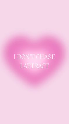 a pink heart with the words i don't chase i attract