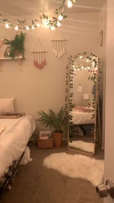 a room with a bed, mirror and plants on the wall next to each other