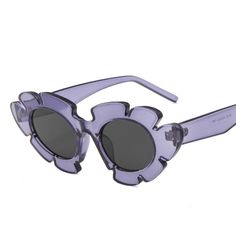 Look chic and eye-catching with the Vintage Flower Cat Eye Sunglasses. Featuring an alluring cut-out flower design and + more colors to choose from, these stylish sunglasses will add vibrancy and elegance to your look. Chic Plastic Cat Eye Sunglasses For Spring, Purple Glass Sunglasses For Spring, Chic Glass Cat Eye Sunglasses For Spring, Spring Chic Plastic Cat Eye Sunglasses, Spring Beach Cat Eye Sunglasses In Plastic, Spring Beach Cat Eye Plastic Sunglasses, Summer Party Sunglasses With Glass Lenses, Spring Beach Cat Eye Sunglasses, Summer Party Sunglasses With Glass