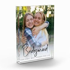 a glass block with two girls hugging each other and the words bridesmaid printed on it