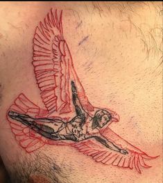 a man with a tattoo on his chest and an eagle in the middle of it