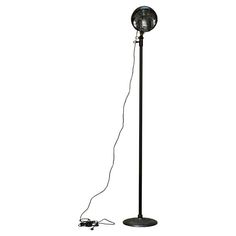 a black floor lamp with a wire attached to it