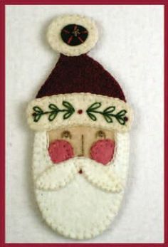 a santa claus ornament hanging on a wall