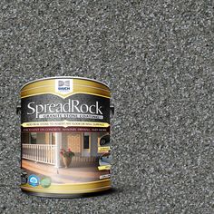 a can of paint sitting on top of a carpeted floor next to a wall