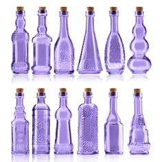 six different types of glass bottles with corks