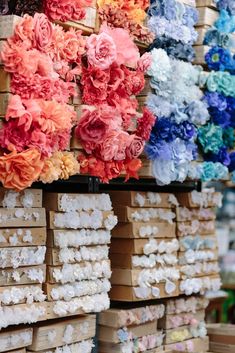 many different colored flowers on display in a store