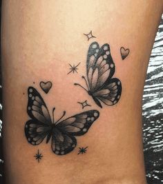 two butterflies with hearts on their backs