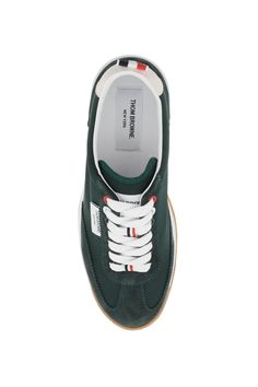 Tech Runner sneakers by Thom Browne crafted in nylon with tone-on-tone suede inserts. Lace-up closure, logo patch on tongue, leather interior with removable insole and tricolor grosgrain loop tab on heel. Clear rubber sole with tricolor inserts. Size Info US Color Detail Green Made In Italia Material 100% calf leather*** 100% PA Season One fall Season Two winter Product shoes Brand Thom Browne Size And Fit Heel Height = 3 cm Latest Fashion Design, Prada Designer, Moon Boots, Sneaker Games, Diaper Backpack, Sporty Look, Thom Browne, Leather Interior, Tri Color