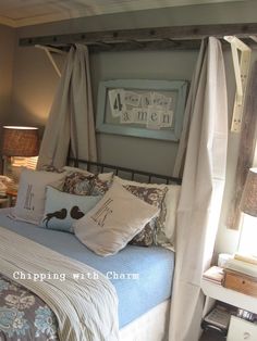 a bedroom with a four poster bed and two nightstands