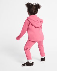 Stay stylish and comfortable with our Kid's Sportswear Tech Fleece Outfit. Made with high-quality fleece material, this outfit provides superior warmth and softness. Perfect for active kids, the moisture-wicking technology keeps them dry and comfortable during all their adventures. Upgrade your child's wardrobe today! More Details Color: Pink Style: 26D736-A5K Sporty Activewear With Fleece Lining For Sports, Pink Sports Sweats With Drawstring Hood, Fleece Sweats With Drawstring Hood For Jogging, Nike Activewear With Drawstring Hood For Gym, Pink Sweats With Drawstring Hood For Sports, Sports Cotton Tracksuit, Fleece Activewear With Drawstring Hood, Pink Sportswear Tracksuit For Sports, Sporty Stretch Fleece Tracksuit