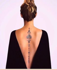 a woman with a tattoo on her back