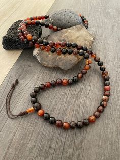 This Brown Agate Mala necklace has a brownish tone that will be easy to match your everyday outfits and keep you calm and grounded if you use it while meditating. Its a unique decor item also. A perfect gift for a yoga lover, or someone that loves stones. You can use it as a necklace or wrap it around the wrist and becomes a bracelet. The Mala necklace has a drop length of 42cm- 16.5 inch. A most have addition to your jewelry collection. ⚡️Join Akashi's VIP list for early bird discount access⚡️ Handmade Brown Necklaces For Layering, Brown Natural Stone Beaded Necklace For Meditation, Spiritual Round Beads Necklaces For Layering, Carnelian Jewelry For Meditation In Brown, Amber Beaded Necklace For Meditation, Adjustable Brown Hand-strung Necklaces, Adjustable Hand-strung Brown Necklace, Brown Carnelian Jewelry For Meditation, Holistic Brown Necklace With Natural Stones