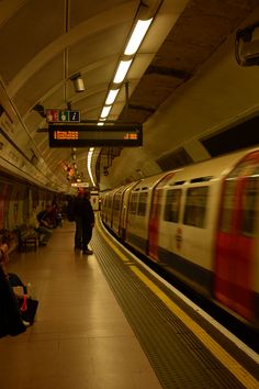 people waiting for the subway to arrive at the station