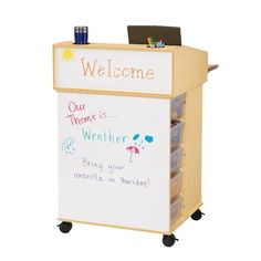 a whiteboard with writing on it and a sign that says welcome to the office