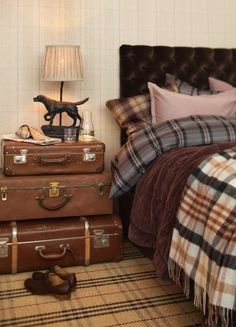 an image of a bedroom with luggage on the floor