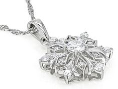 Moissanite Fire® .56ctw diamond equivalent weight round brilliant, Platineve® snowflake pendant and 18 inch Singapore chain. Measures approximately 1" L x 5/8" W. Chain has a lobster clasp and two inch extender. Actual moissanite weight is .53ctw. Diamond White Cubic Zirconia Snowflake Jewelry, Diamond White Snowflake Jewelry For Anniversary, Diamond White Snowflake Jewelry For Formal Occasions, Formal Snowflake Diamond White Jewelry, White Gold Diamond Snowflake Jewelry, Formal Diamond Snowflake Jewelry, Formal Snowflake Diamond Jewelry, Fun Clothes, Snowflake Pendant