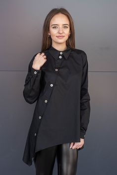 ➤ Features Length: front - 60cm, back - 70 cm Blouse with collar Long sleeves Hip length cut Asymmetrical ● The model is 5'5″ (168cm) tall ● The model is a S ➤ Sizing SIZE CHART (cm/inch) XS-bust 85/33.5, waist 66/26, hips 91/35.8 S-bust 90/35.5, waist 71/28, hips 97/38 M-bust 95/37.4, waist 76/30, hips 102/40 L-bust 102/40, waist 83/32.7, hips 109/43 XL-bust 109/43, waist 90/35.5, hips 116/45.5 2XL-bust 116/45.5, waist 97/38, hips 123/48.5 3XL-bust 123/48.5, waist 104/41, hips 130/51 4XL-bust 1 Asymmetrical Cotton Shirt, Oversized Asymmetrical Cotton Shirt, Chic Cotton Shirt With Asymmetrical Hem, Trendy Asymmetrical Office Blouse, Chic Asymmetrical Cotton Shirt, Oversized Shirt With Asymmetrical Hem, Elegant Tunic With Buttons, Modern Asymmetrical Black Blouse, Fall Asymmetrical Office Blouse