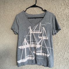 Great Tee! Light Weight, Super Soft, Loose Fit, Bleached Sailboat Design, And Never Worn. Ready To Ship! Excellent Condition Tommy Hilfiger Crew Neck Top For Summer, Tommy Hilfiger Summer Crew Neck Top, Tommy Hilfiger Casual Graphic Print Tops, Tommy Hilfiger Graphic Print Tops For Spring, Tommy Hilfiger Graphic Tee For Spring, Fitted Tommy Hilfiger V-neck Tops, Tommy Hilfiger Fitted V-neck Tops, Fitted V-neck Tommy Hilfiger Tops, Casual Tommy Hilfiger V-neck Top