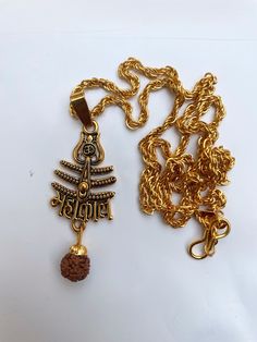 Top Quality/Never Fade/ Divineorigin Brand New Design/Anty-Allegy,1 Pendant is included in this Package,,Height of Pendent is 35 mm (approx.), width is 35 mm (approx.) & Chain Length is 440 mm and Weight is 25 gm.(approx.), Material:Brass & Wood ,Colour:Gold & Brown ,Chain Material:Brass & Wood Wearabiity: Goes well with casual wear, party wear and college wear,Anniversary Gift::Welding Gift::Love Promise Gift::Birthday Gift Special gift on Christmas Gift,Valentine days Friendship Day.Love gifts Festive Temple Necklace With Locket For Puja, Brass Temple Necklace With Latkans For Puja, Temple Necklace With Locket For Diwali Puja, Diwali Temple Necklace With Locket For Puja, Diwali Puja Temple Necklace With Locket, Gold Mala With Tilla For Puja, Gold Mala As Navratri Gift, Gold Mala For Navratri Gift, Spiritual Temple Necklace With Latkans For Navratri