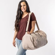 Nothing beats the simplicity and functionality of a good duffel bag—except maybe our Bumi Eco Duffel Bag, made with the good of the environment and people in mind! The perfect size for a spontaneous weekend getaway or when you need a little more room to haul daily gear for work or athletics. Made with 14-oz Certified Fairtrade Organic cotton canvas. Made in a Fair Trade Certified™ factory. Beige Large Capacity Gym Bag For Everyday Use, Large Capacity Beige Gym Bag For Everyday Use, Versatile Beige Duffle Bag For Daily Use, Beige Tote Weekender Bag For Overnight Trips, Everyday Large Capacity Beige Duffle Bag, Everyday Beige Duffle Bag With Large Capacity, Versatile Beige Everyday Duffle Bag, Everyday Practical Duffle Bag With Adjustable Strap, Casual Beige Bag For Overnight Trips