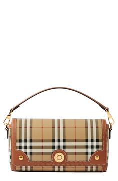 Burberry check patterns this coated-canvas bag trimmed in topstitched leather, accented with gleaming hardware and convertible from crossbody to clutch. Magnetic-snap flap closure Removable top carry handle; removable, adjustable crossbody strap Interior card slot Textile with leather trim Made in Italy Designer Handbags Classic Coated Canvas Flap Bag With Detachable Strap, Designer Coated Canvas Flap Bag With Detachable Strap, Bags Aesthetic, Burberry Handbags, Brown Plaid, Fabric Gift Bags, Burberry Women, Fabric Gifts, Small Handbags