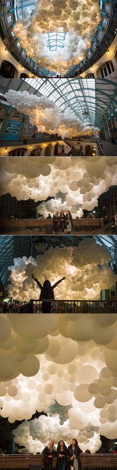 the inside of a building with clouds in it