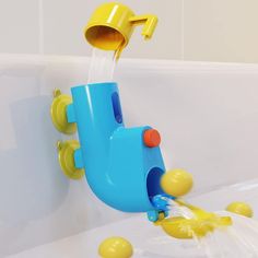 a blue and yellow water faucet in a bathtub