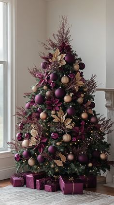 a christmas tree with purple and gold ornaments