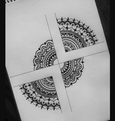 an intricate design is shown on top of a piece of paper with scissors in front of it