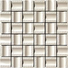 a white tile wall with squares and rectangles