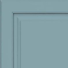 a close up view of the front door and side panel of a blue kitchen cabinet