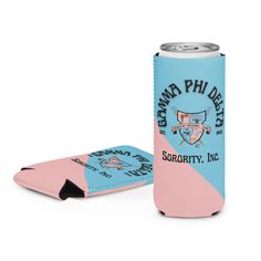 a pink and blue can cooler sitting next to a white background