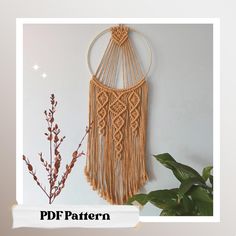 an image of a wall hanging made out of macrame and yarn with the words pddf pattern below it