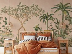 a bedroom decorated with tropical wallpaper and bedding, along with two nightstands