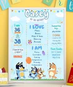 a birthday poster with cartoon characters on it next to a cake and cupcakes