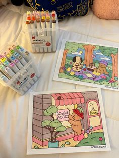 two children's coloring books and crayons on a bed